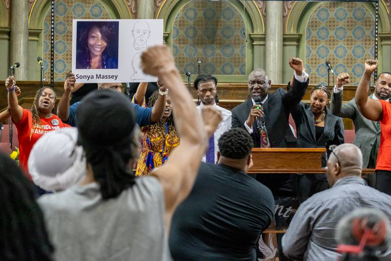 Attorney Ben Crump, who is representing the family of Sonya Massey, raises his fist during a speech at a rally Tuesday, July 30, 2024, in Chicago.