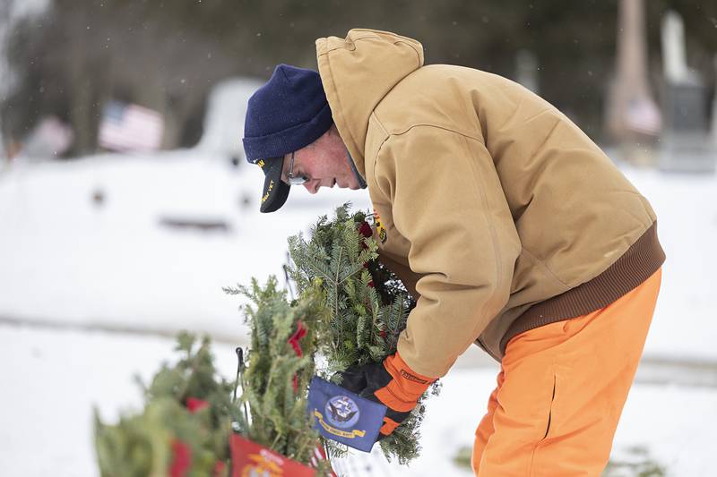 Jim Devine places a wreath that recognizes the USAF Saturday, Dec. 13, 2025.