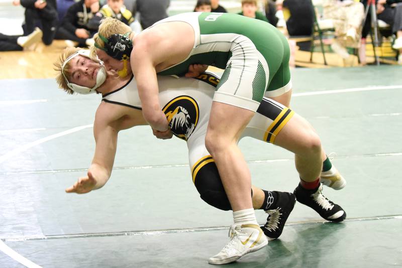 Coal City's Cade Poyner, right, takes down Herscher's Colton Carson during the Illinois Central Eight Conference 215-pound championship match at Coal City Saturday, Jan. 24, 2026.