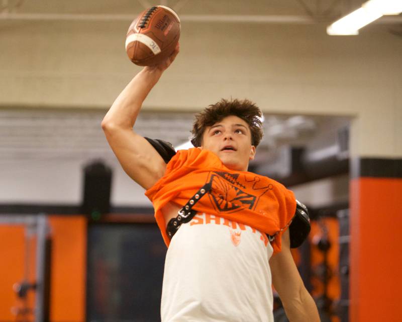 St. Charles East's Leo Bolsoni makes a jumping catch during drills on Monday, Aug.18,2025 in St. Charles.