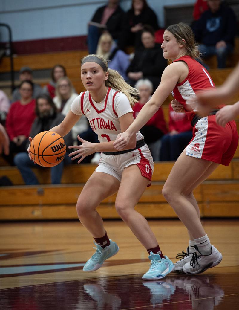 Ottawa's Addy Miller controls the ball as Streator's Rhea Huey guards during Tuesday's Class 3A Kankakee Regional.