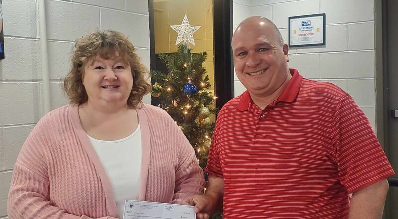 Grant Knight Shawn LeRette with Father Peter E. Hand Knights of Columbus Council 4537 in Sheffield presented a check for $500.30 to Tracy Wright, CEO of Gateway Services.
