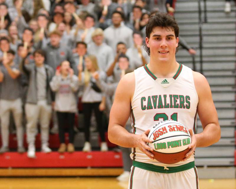 L-P senior Josh Senica holds a 1,000-point club basketball on Tuesday, Nov., 28, 2023 in AJ Sellett Gymnasium at L-P High School.