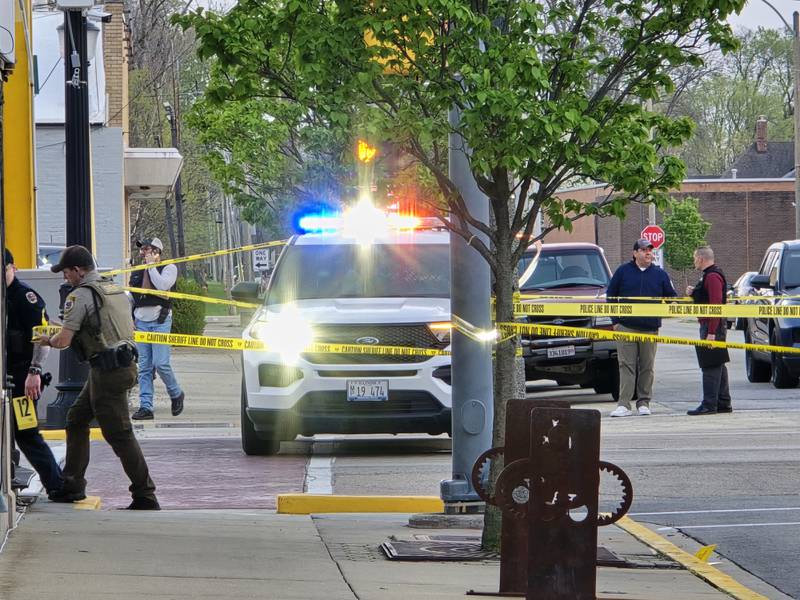 Police investigate a shooting Sunday, April 20, 2025, at the intersection of Sterling and Main streets in downtown Streator.