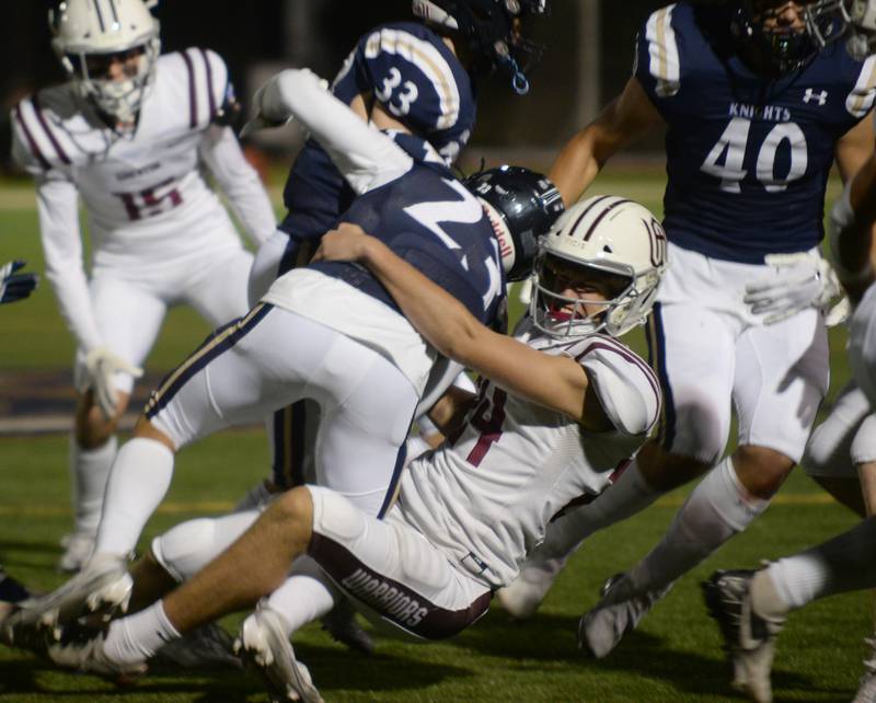Wheaton Academy's Declan Schneider takes down Immaculate Conception's  Anthony Palmeri during their game held Friday Sept 30, 2022.
