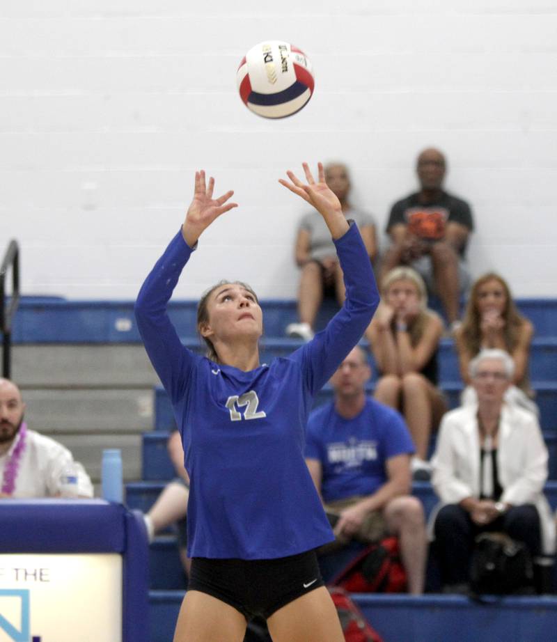 St. Charles North’s Kyra Treanor sets the ball during a game at Rosary in Aurora on Monday, Aug. 21, 2023.