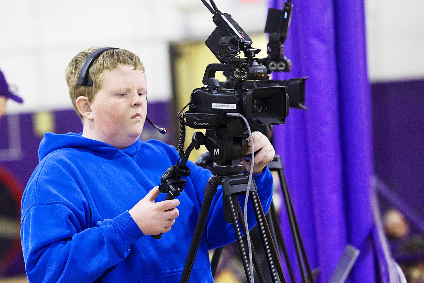 Dixon High School Broadcasting Club member Jake Lohse works Thursday, Feb. 19, 2026, at the Class 3A girls basketball regional title game at Lancaster Gymnasium.