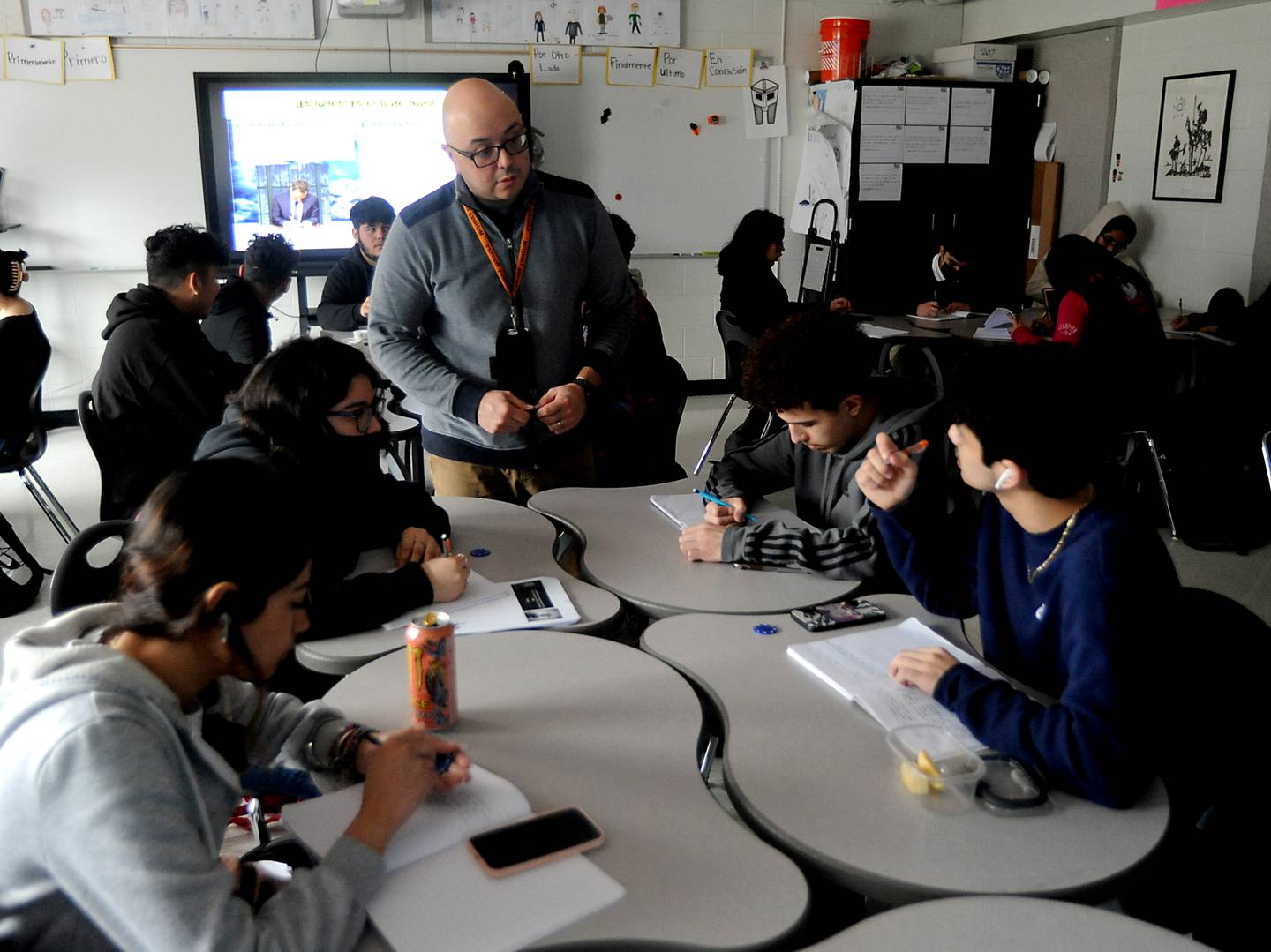 Otto Corzo talks with students Monday, April 11, 2022, as he teaches a Spanish literature class at McHenry High School. Corzo was named a Golden Apple finalist this year for his teaching.