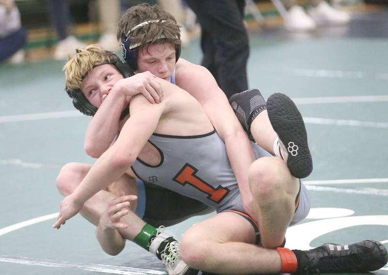 Marquette's Brysen Manly wrestles Sandwich's Joshua Kotalik in the 150 pound weight class during the Class 1A Regional meet on Saturday, Feb. 8, 2025 at St. Bede Academy.