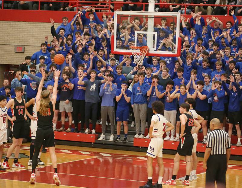 Marmion superfans shout as Metamora's Ethan Kizer shoots a free throw during the Class 3A Super-Sectional on Monday, March 6, 2023 at Ottawa High School.