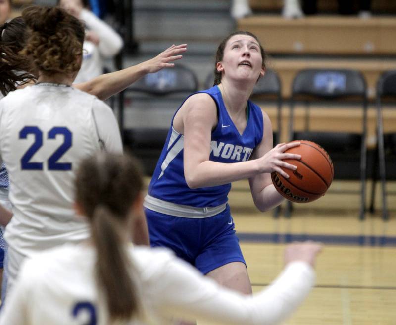 Wheaton North’s Elsa Carlson looks for a shot from under the basket during the Class 4A St. Charles North Regional final against St. Charles North on Thursday, Feb. 16, 2023.