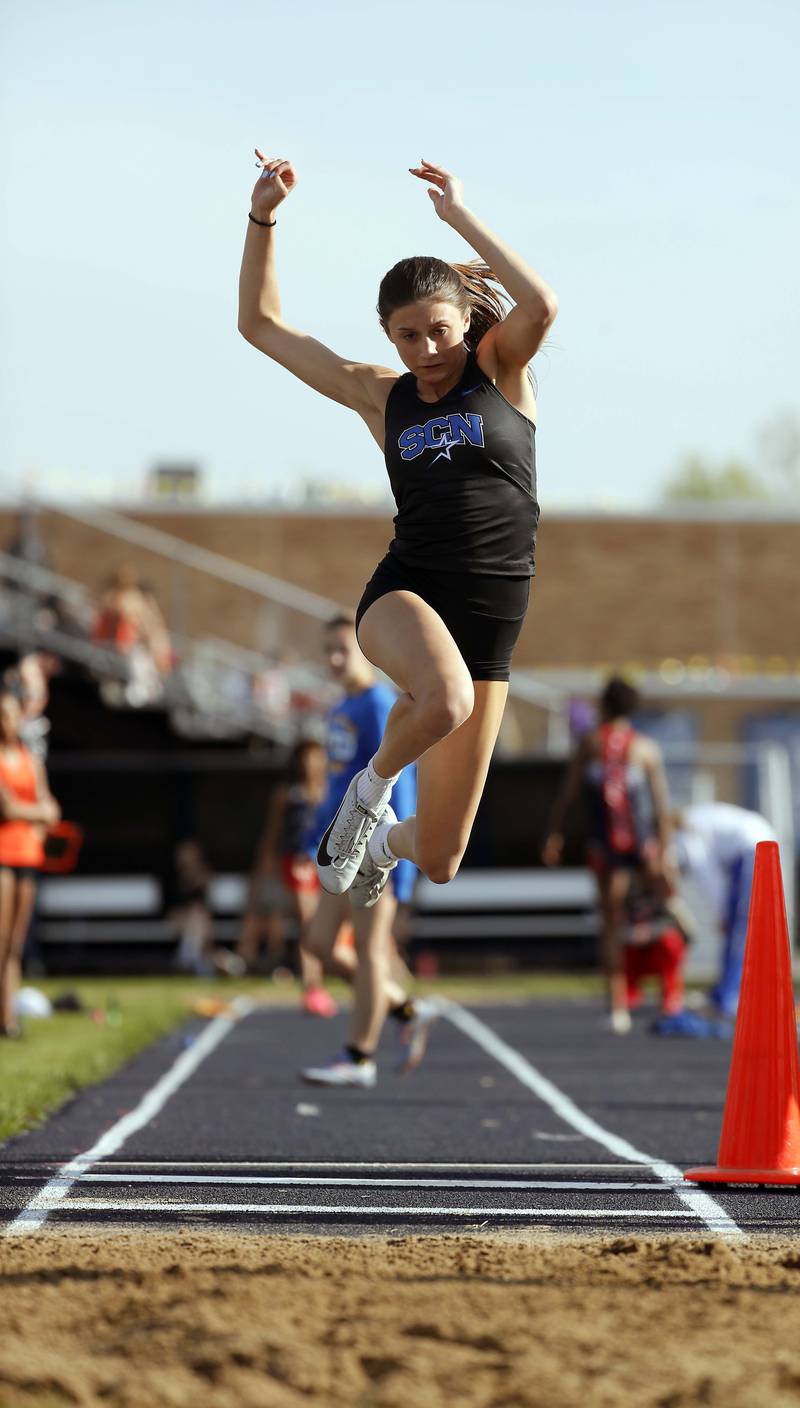 Lexie Sutter, of St. Charles North competes in the long jump during the Kane County girls track and field meet Thursday April 27, 2023 in Aurora.