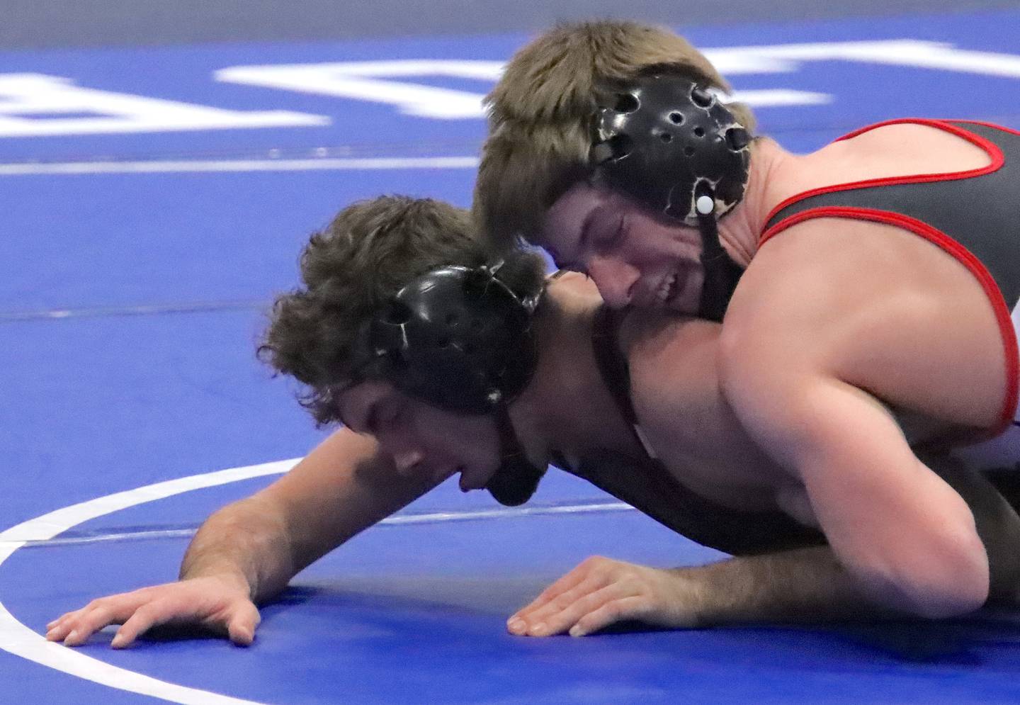 Yorkville's Jack Ferguson takes control of the 150-pound championship match against Connor Cumbee from Joliet Catholic at the Quincy Class 3A Sectional on Saturday.