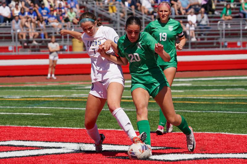 Lyons’ Caroline Mortonson (7) challenges York’s Mia Barton (20) for the ball in the box during a Class 3A Hinsdale Central Sectional girls soccer championship match at Hinsdale Central High School on Saturday, May 25, 2024.