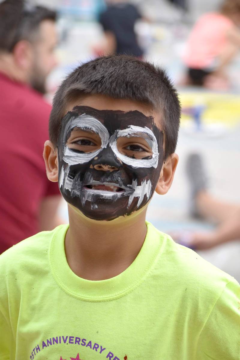 Painting squares on pavement and painting faces went hand-in-hand on Saturday during Paint the Town in Morrison.