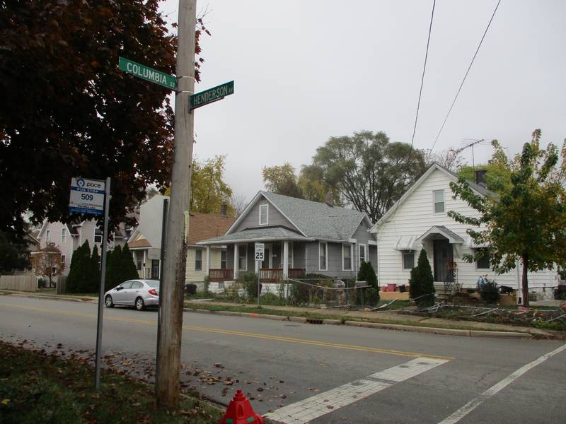 Street sign marks the corner of Henderson Avenue and Columbia Street in Joliet where a man died Sunday afternoon when he was shot while driving. Oct. 31, 2022.