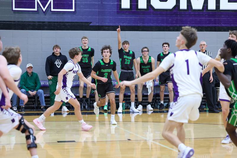 Bishop McNamara players cheer on their teammates from the bench during the Fightin' Irish's 61-24 victory over Manteno on Tuesday, Jan. 13, 2026.