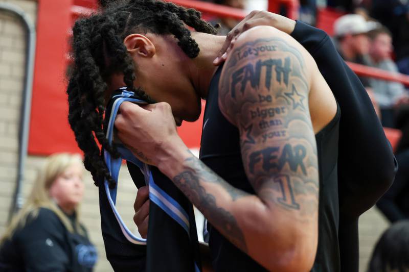 Kankakee's Lincoln Williams is comforted as he leaves the court following the Kays' 61-48 loss to Morton in the IHSA Class 3A Ottawa Sectional championship on Friday, March 6, 2026.