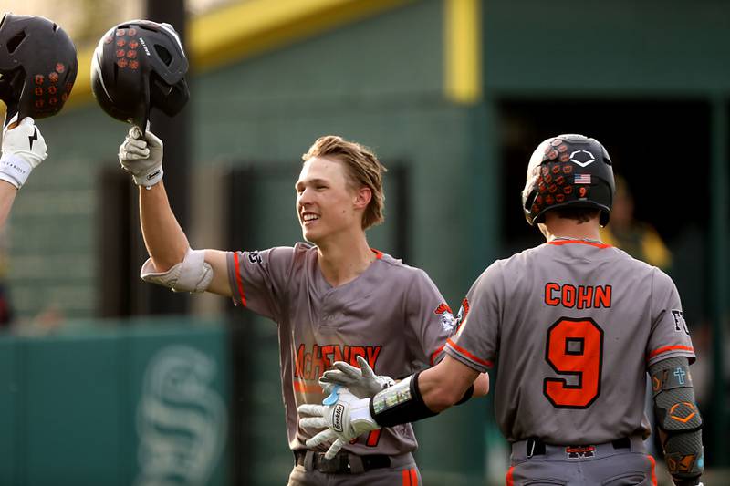McHenry's Landon Clements celebrates his  home run with teammate, Carver Cohn, during a Fox Valley Conference baseball game against Crystal Lake South on Monday, April 13, 2026, at Crystal Lake South High School.