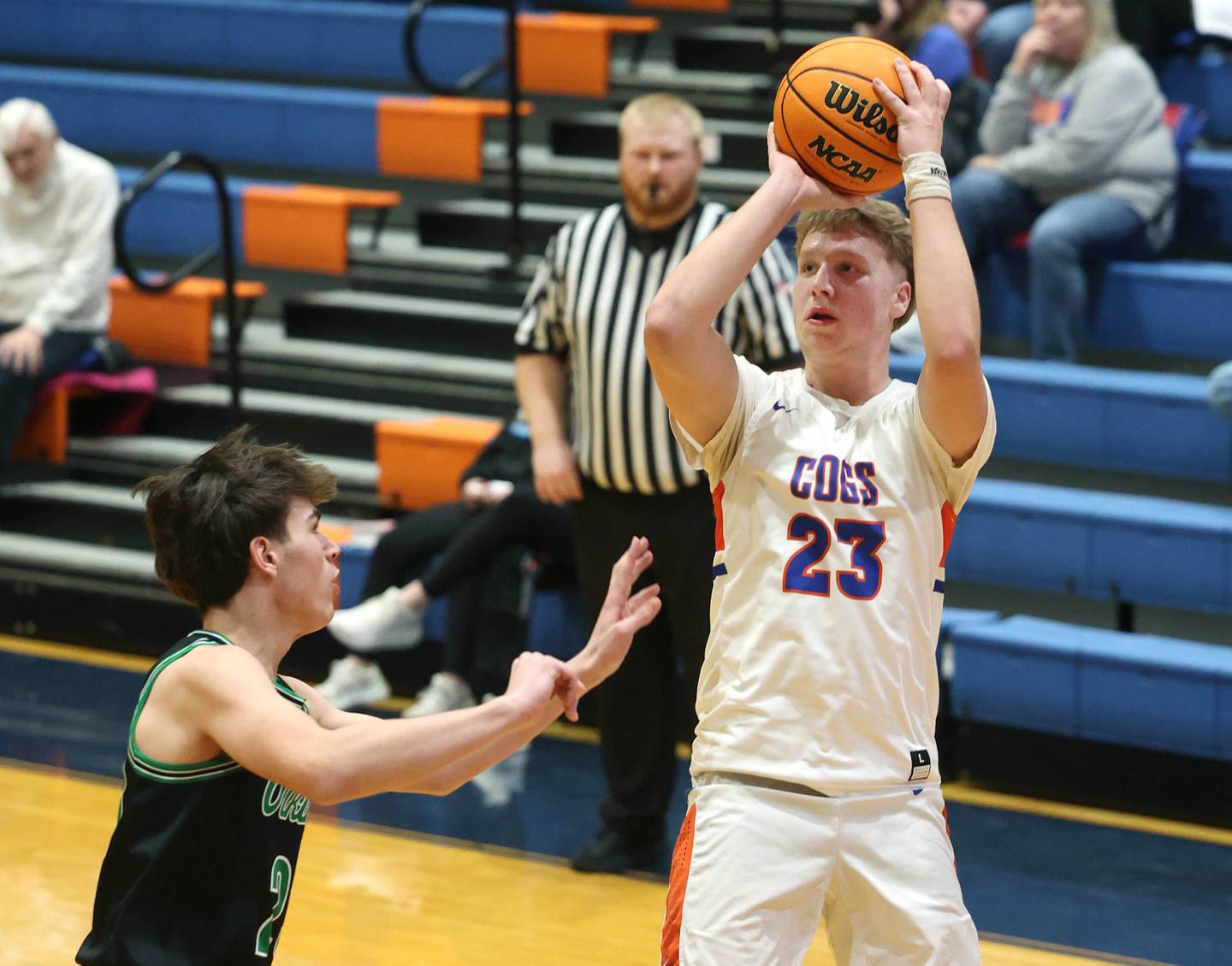 Genoa-Kingston's Hayden Hodgson shoots over North Boone's Michael Persson during their Class 2A regional game Monday, Feb. 24, 2025, at Genoa-Kingston High School.