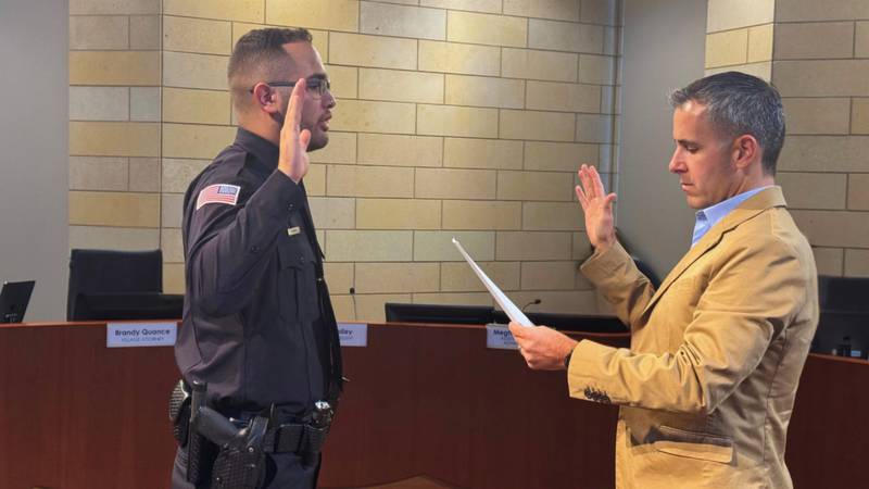 New Montgomery Police Officer Jovani Chaidez gets sworn in by Village President Matt Brolley on Sept. 8, 2025.