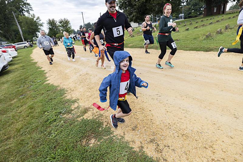 Thirty-five runners fire off the line during the Zom-G 5K Saturday, Sept. 16, 2023 in Dixon.
