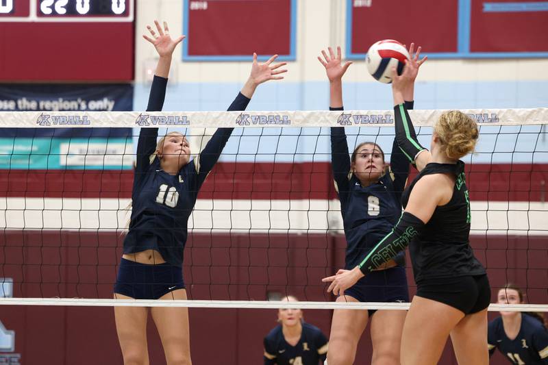 Lemont's Maddie Maloney (8) and Marta Pranskunas jump to block a hit by Providence's Kennady Kotowski during Lemont's loss two sets, 25-25, 25-18, to Providence in the IHSA Class 3A Kankakee Sectional championship on Thursday, Nov. 6, 2025.