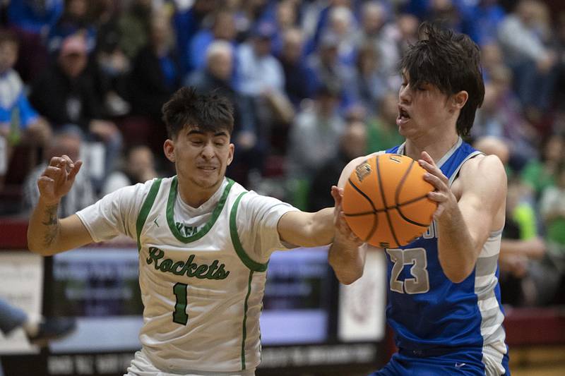 Rock Falls’ Austin Castaneda swats the ball away from Princeton’s Noah Laporte Friday, March 7, 2025, in the Class 2A boys basketball Sectional final in Marengo.