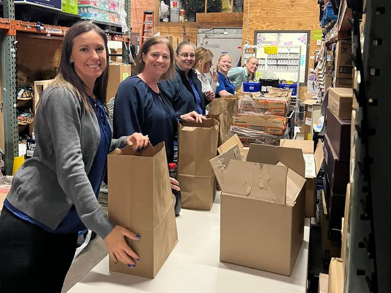 Volunteers help pack bags for the “Feed Our Children” food drive set Friday, May 24, 2024, at Peru Hy-Vee.