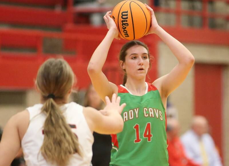 L-P's Drew Depenbrock looks to pass around Metamora's Baylie Nena during the Ottawa Girls Holiday Tournament on Monday, Dec. 16, 2024 in Kingman Gym at Ottawa High School.