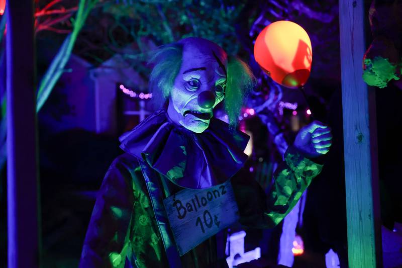 A clown greets visitors at the newest Halloween display by Dave Appel HorrorProps, who made national attention with his “Stranger Things” display, on Thursday, Oct. 17, 2024 in Plainfield.