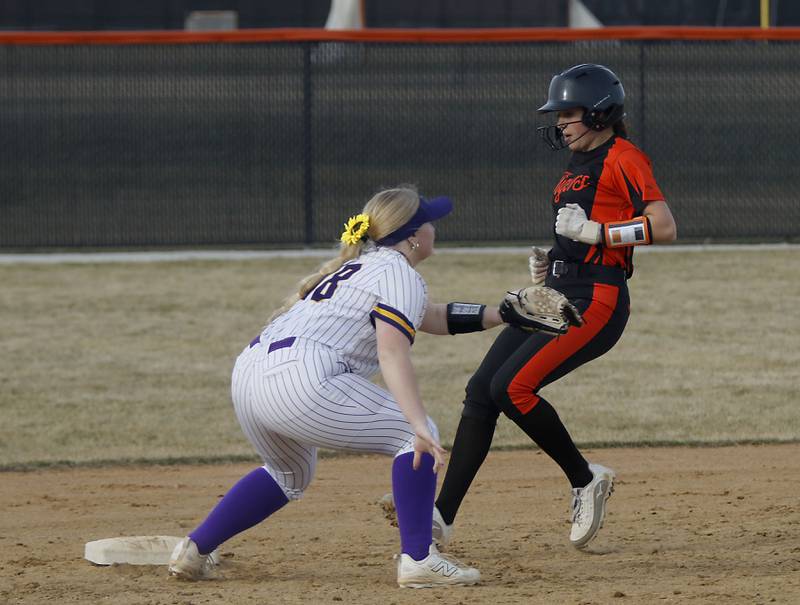 Crystal Lake Central's Oli Victorine runs to second as Wauconda's Kylie Karaszewski waits for the throw during a nonconference softball game on Friday, March 20, 2026, at Crystal Lake Central High School. Victorine advance to second base after an error a first.