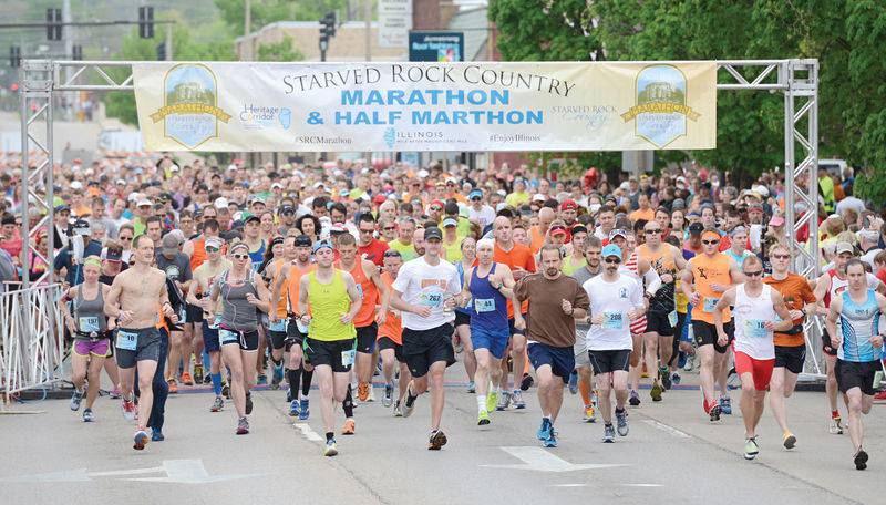 Runners in the Starved Rock Country Marathon take off from the starting line during a past running of the event.