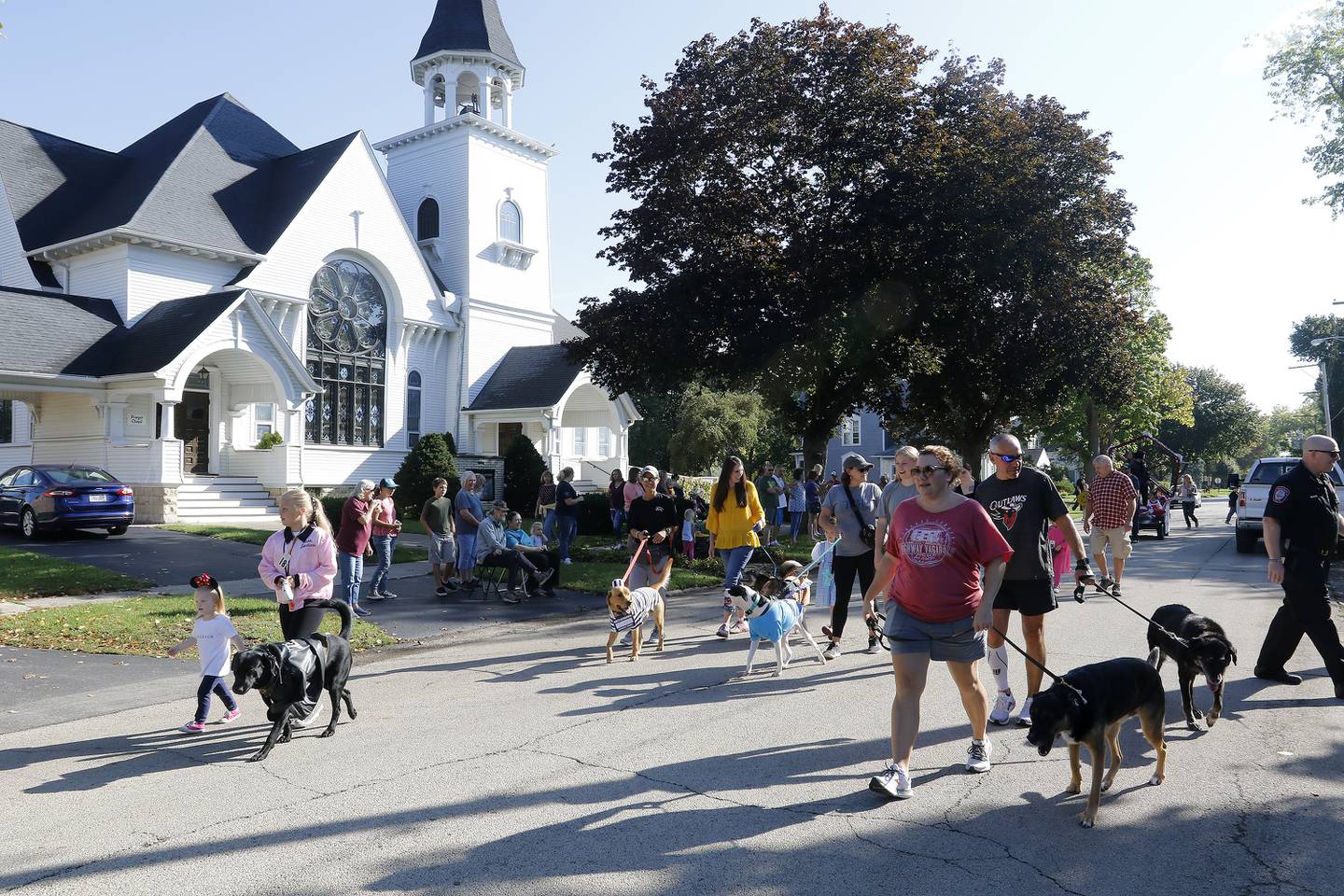 Dogs are paraded through town in the Children's Pet Parade during the annual Settlers Days events on Saturday, Oct. 9, 2021 in Marengo.