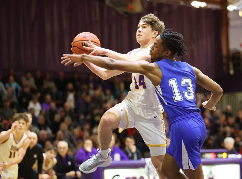 DGN's Maxwell Haack (14) drives to the basket during the boys 4A varsity regional final between Downers Grove North and Proviso East in Downers Groves on Friday, Feb. 24, 2023.