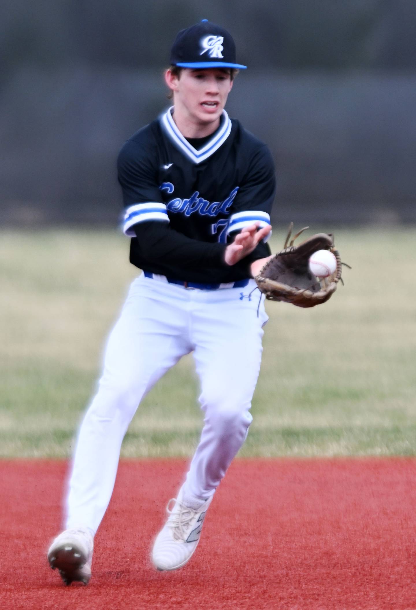 Burlington Central shortstop Wagner Viebrock fields a ground ball during Friday’s game at Barrington.