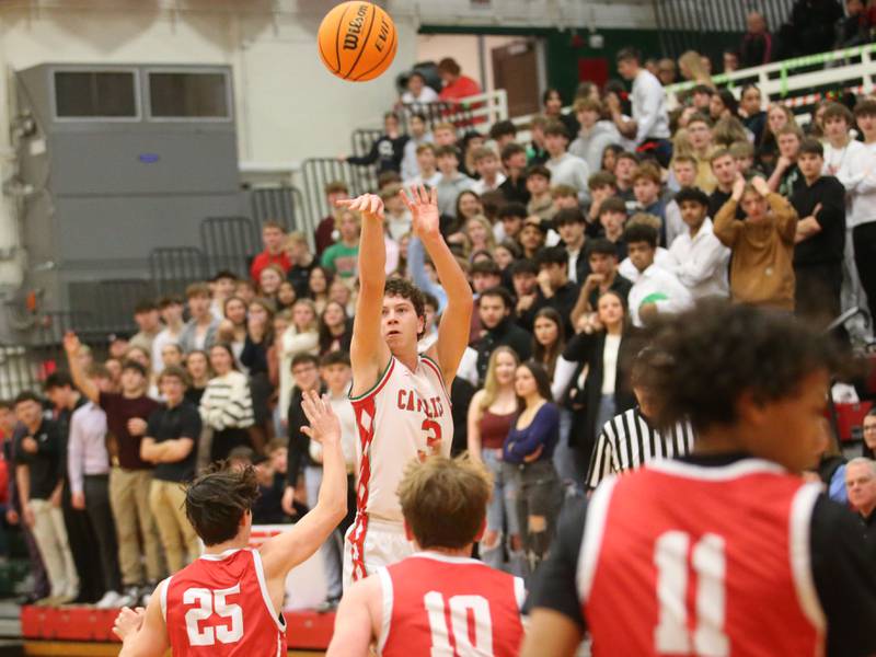 L-P's Mikey Hartman drains a three point shot over Ottawa's Lucas Farabaugh on Friday, Feb. 7, 2025 in Sellett Gymnasium at L-P High School.
