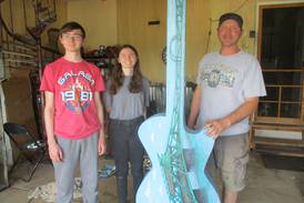 Father and twins contribute to Joliet guitar art