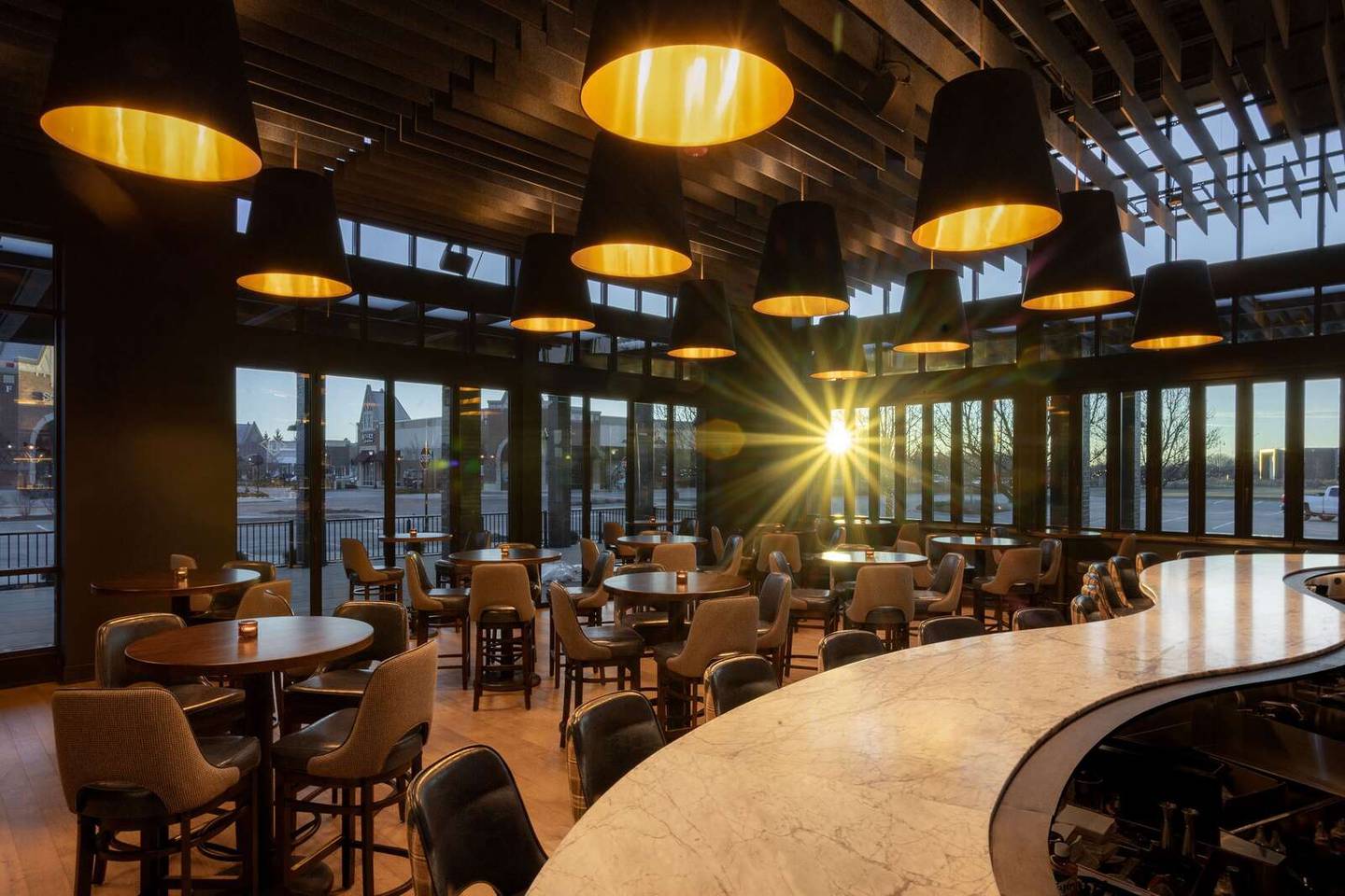 A custom-designed S-shaped counter is a highlight of the bar space at The Greggory.