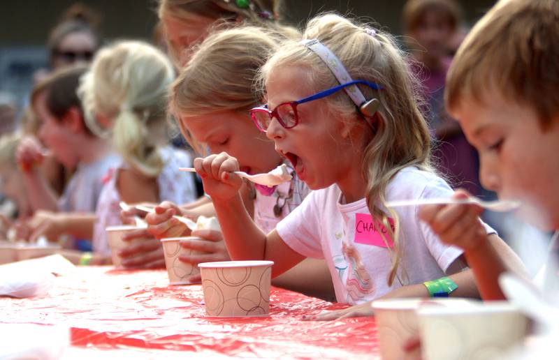 Five-and-three-quarters-years-old Charlotte Foster of Crystal Lake takes part in an ice cream-eating contest Friday, Aug. 18, 2023, as part of Julie Ann’s first-ever Ice Cream Fest at Crystal Lake’s Main Beach.