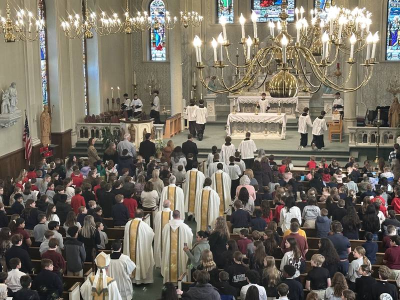 A procession of clergy enter St. Patrick's Catholic Church during the All Schools Mass on Thursday, Feb. 20, 2025 in La Salle. The Most Reverend Bishop Louis Tylka, Bishop of Peoria gave Mass while announcing a new name for the three schools calling it Carlo Acutis. Last year, the Catholic Diocese of Peoria announced the consolidation of the three schools. Carlo Acutis Canonization will take place on Sunday, April 27, 2025 during the Jubilee of Teenagers in Rome. Acutis is the first millennial saint, representing those born between the early 1980's and the late 1990's. He is celebrated for cataloging miracles and online and managing websites for Catholic organizations.