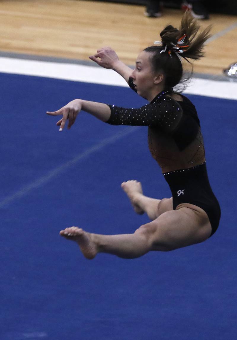 Libertyville’s Anna Becker competes in the preliminary round of the floor exercise Friday, Feb. 17, 2023, during the IHSA Girls State Final Gymnastics Meet at Palatine High School.