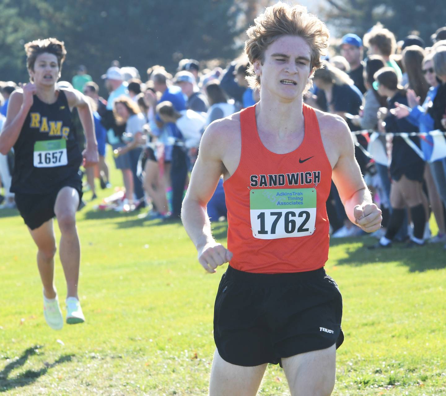 Sandwich's Wyatt Miller grimaces as he sprints to the finish line ahead of Riverdale's Mitchell Hassnour to finish 19th at the 1A Oregon Sectional on Saturday, Oct. 29.