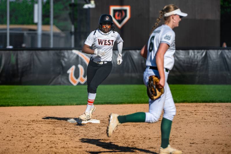 Lincoln-Way West's Olivia Calderone rounds 2nd after hitting a home run during a game against Plainfield Central on Friday May 3, 2024 at Lincoln-Way West in New Lenox