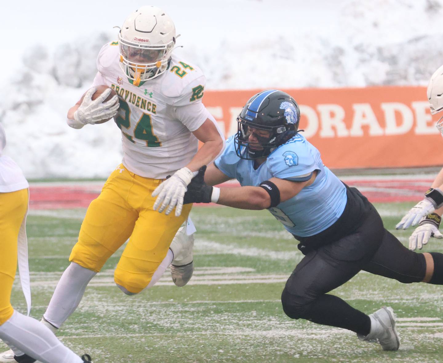 Providence Catholic's Broden Mackert avoids the tackle from St. Francis's Preston Shipley during the Class 5A State championship on Tuesday, Dec. 2, 2025 in Hancock Stadium at Illinois State University in Normal.