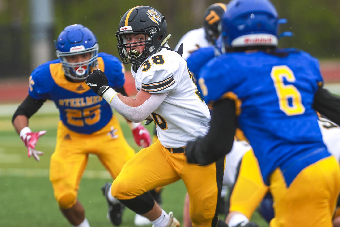 Joliet West running back James Zilinger rushes for a first down on Saturday, April 10, 2021, at Joliet Central High School in Joliet, Ill.