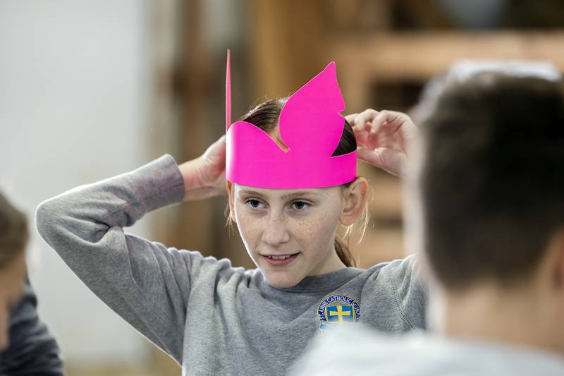 Myka Oliver, a fifth grader at St. Anne’s in Dixon, puts on a pair of pigs ears Friday, April 25, 2025, during Ag Expo in Amboy.