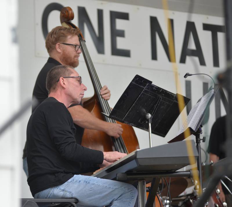 Two members of the the All-Star Superband play their instruments - a standup bass and keyboards - on Wednesday, Aug. 27, 2025 at the Mt. Morris Jamboree Concert Series in Mt. Morris.