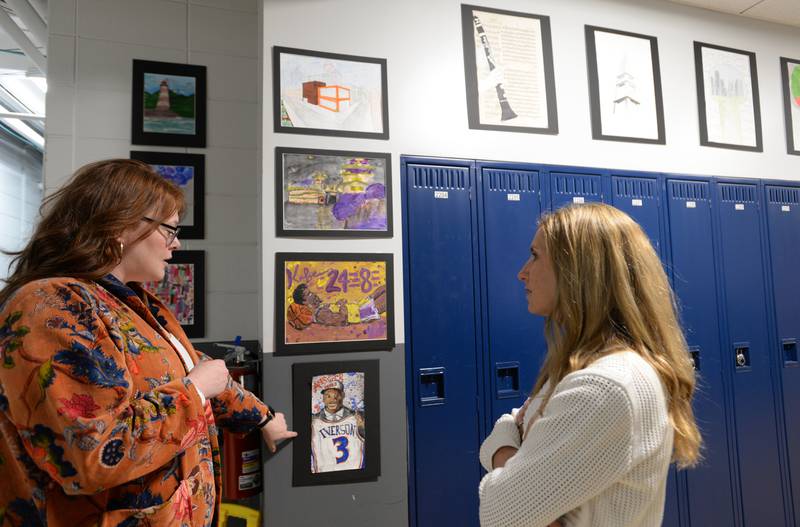Nazareth Art Department Chair, Kelly Pack discusses a students work with parent Julie Lopez during during the Expressive Arts Showcase held Monday, April 8, 2024.