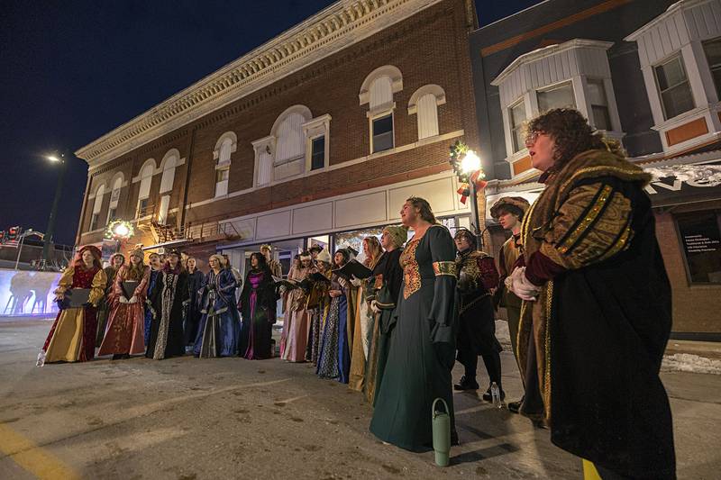 The Dixon High School madrigal singers perform in downtown Dixon Friday, Dec. 5, 2025, during the Christmas Walk. The group roamed around and sang a several songs.